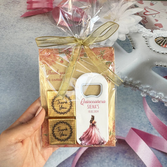 Quinceañera party souvenirs featuring a personalized magnet, card, and two delicious chocolates, perfect for thanking your guests.