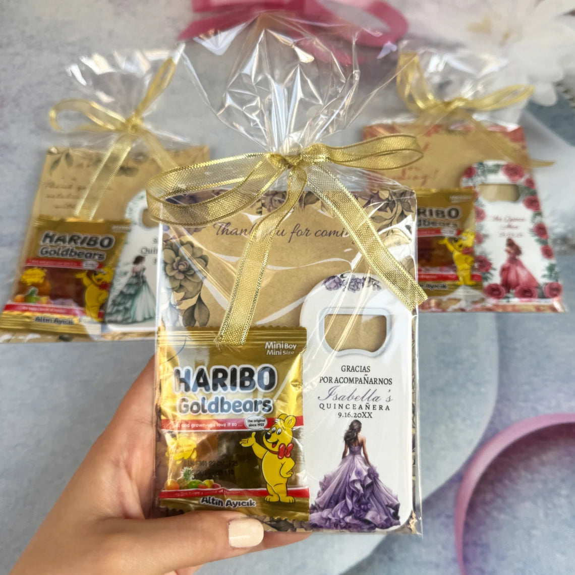 Quinceañera party gift pack including a personalized magnet, card, and gummy treats, perfect for celebrating your special occasion.